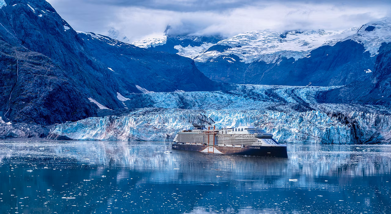 Celebrity Edge cruising Dawes Glacier in Alaska on a hosted journey