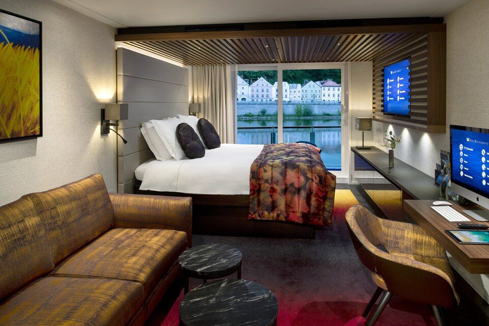 AmaWaterways balcony stateroom with a river view, luxury river cruise stateroom